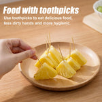 Uniformly polished round wooden toothpicks arranged neatly to highlight the burr free textured finish.