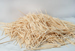 Disposable bamboo wood toothpicks being used to serve party snacks and finger foods