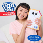 Frosted Strawberry Pop-Tarts heating pad held in hands