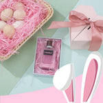 Hand fluffing light pink shredded paper for gift hampers