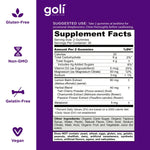 Close up of purple berry flavored Goli sleep gummies outside the bottle on a clean background