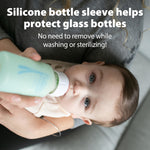 BPA-free borosilicate glass baby bottles being disassembled to show reservoir tube and silicone nipple details