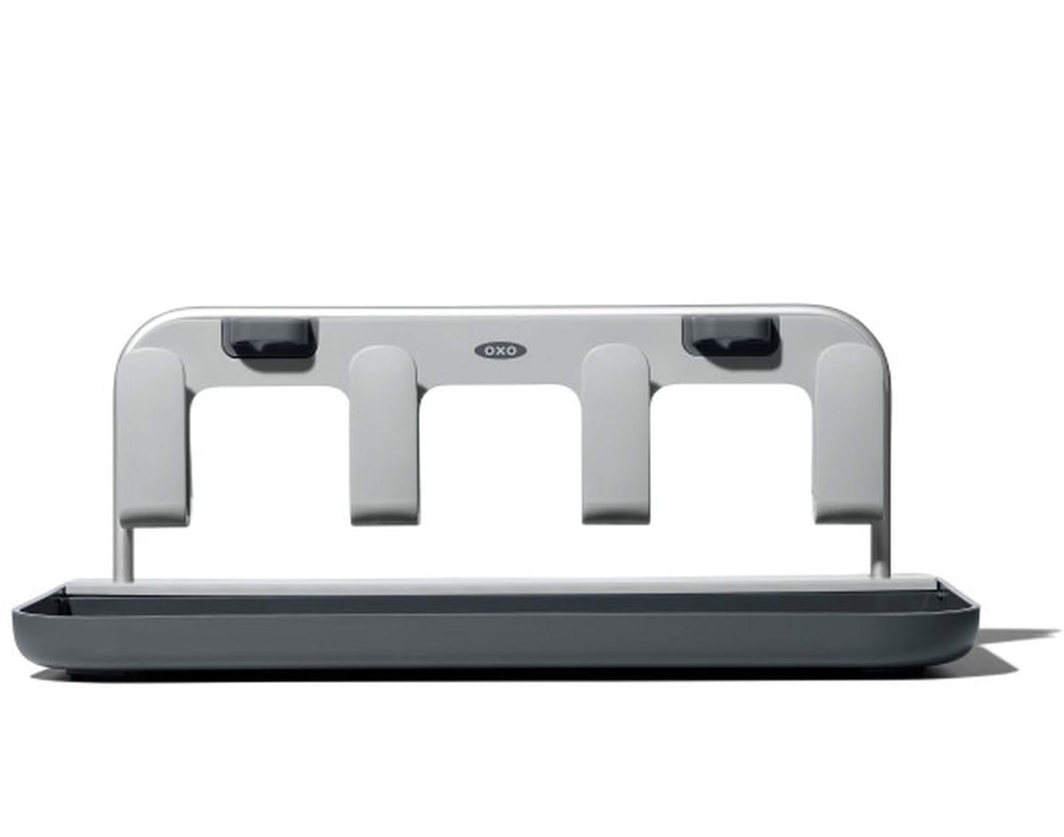 Oxo bottle drying rack holding four water bottles and lids