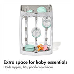 Close up of angled pegs on baby bottle drying rack