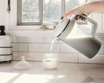 Baby Brezza one step formula mixer pitcher preparing twenty eight ounces of infant milk