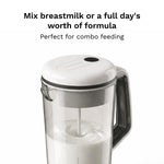Baby Brezza automatic infant bottle mixing system with formula powder being smoothly blended by the motorized wand without air bubbles.