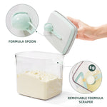 Hygienic scoop holder inside the Tourdeus clear formula dispenser showing clean storage design