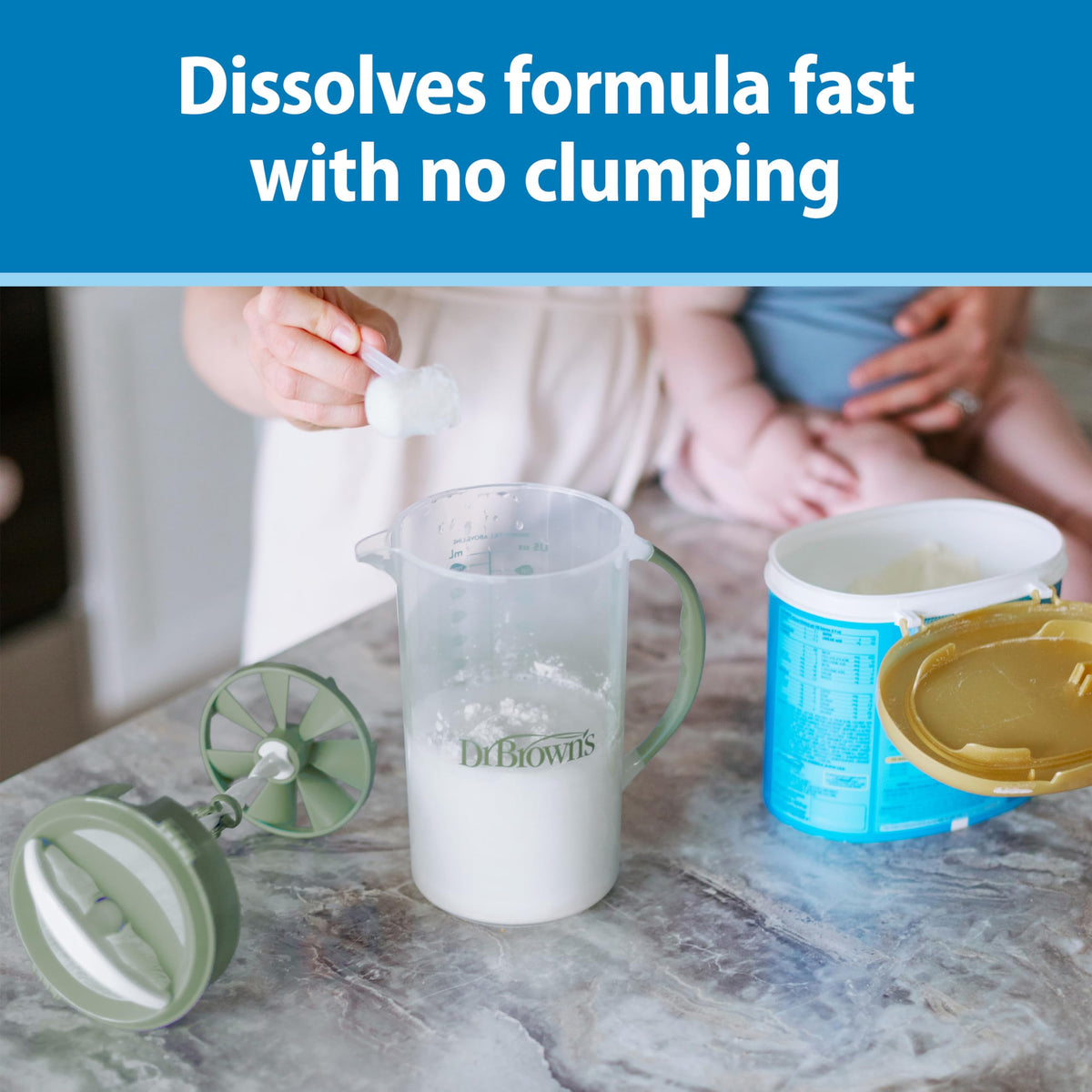 Dr. Brown's infant formula mixer with the unique blade assembly pulled out to display the anti-clumping mechanism.