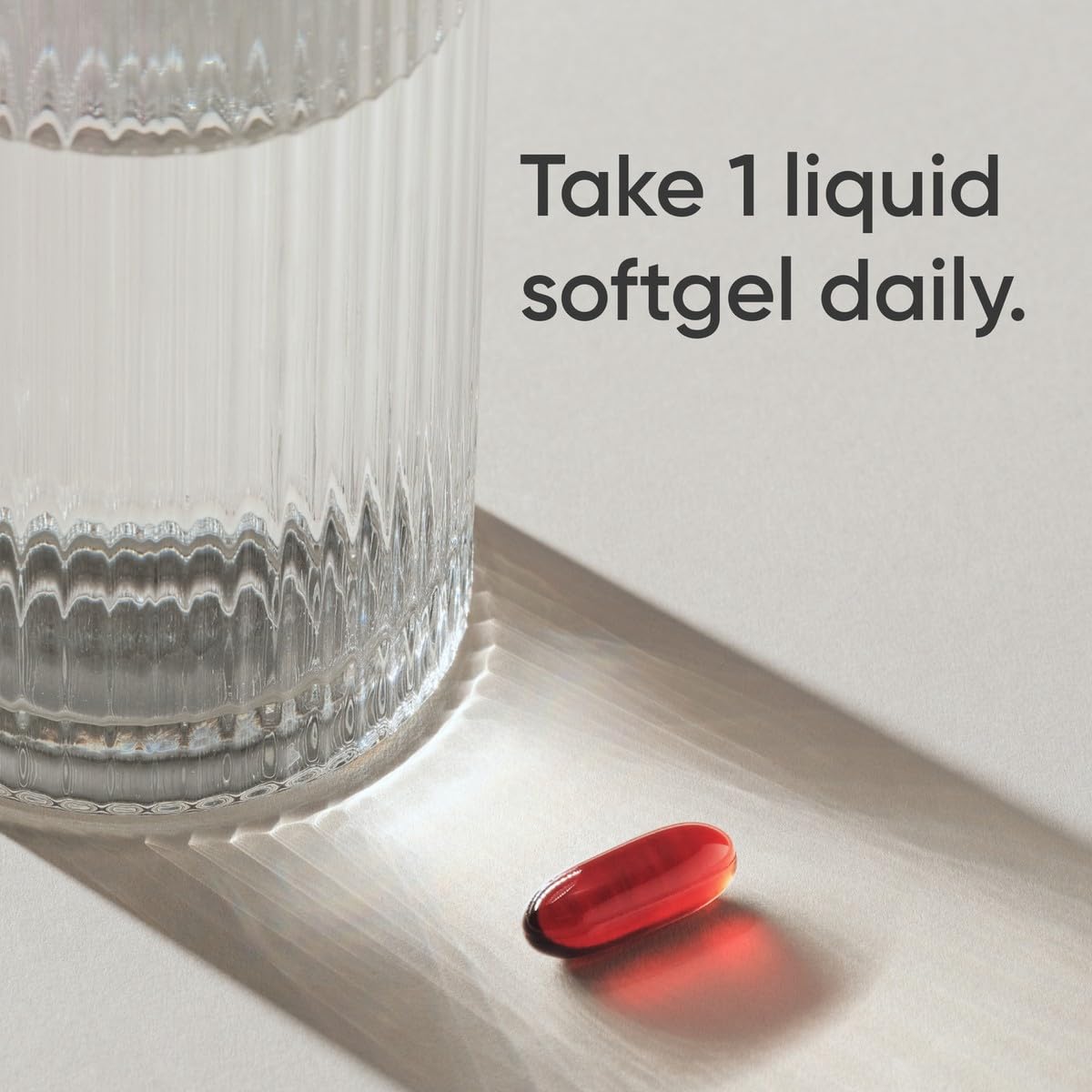 Authentic USA imported Sports Research krill oil softgels showcasing the rich red astaxanthin antioxidant color.