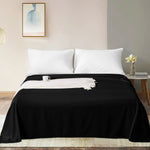 Full view of the luxurious FLXXIE 1800 count brushed microfiber top sheet draped over a King size mattress.