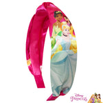 Flexible pink satin styling band for toddlers showing stretchability and comfortable fit dimensions.