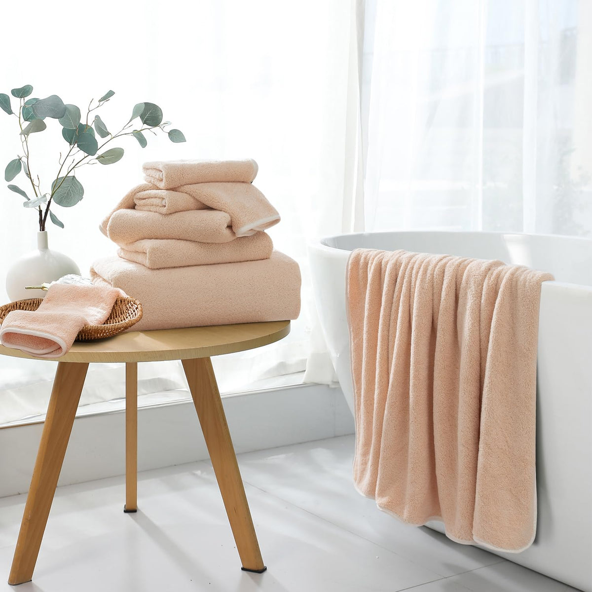 Maggea microfiber bath towels stacked in a bathroom