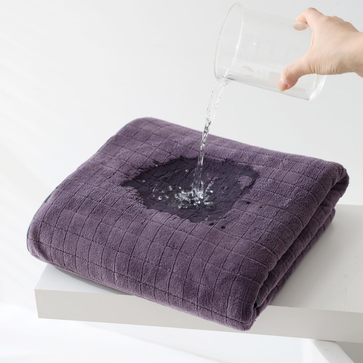 Plum colored microfiber bath towels displayed in a bathroom setting