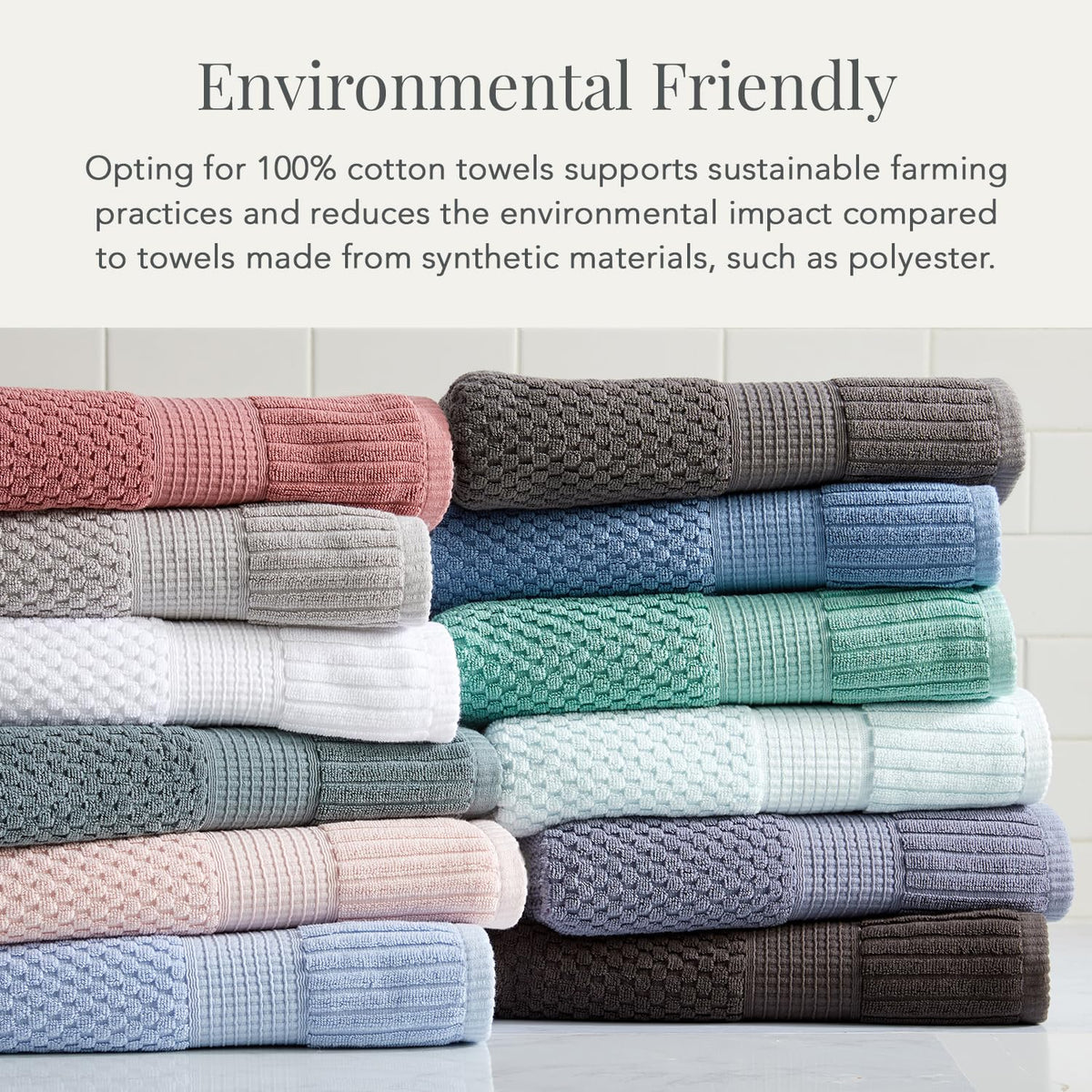Bright white NY Loft bath towels stacked in bathroom