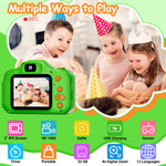 Green SplashNSpray children camera being held by a young child demonstrating its portable compact size.