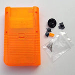 Back view of the transparent orange replacement console casing showing the battery compartment cover and included security screws.