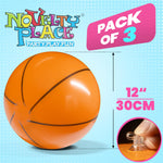 Novelty Place twelve inch floating basketball toy being inflated for summer pool games