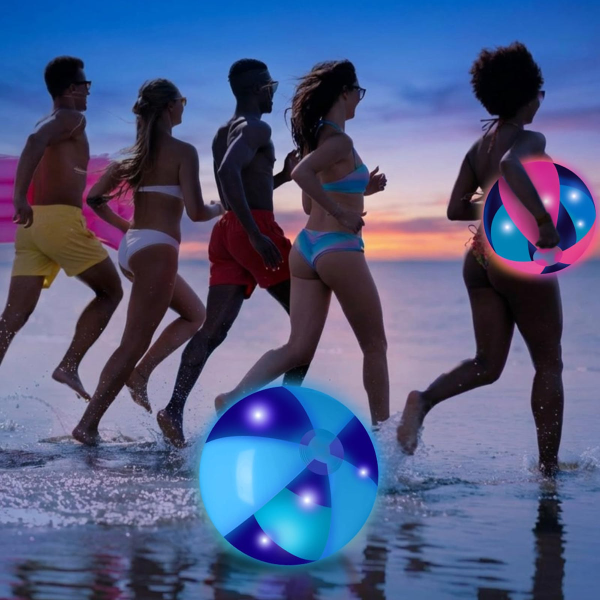 Adults playing with giant neon inflatable balls at an outdoor evening music festival.