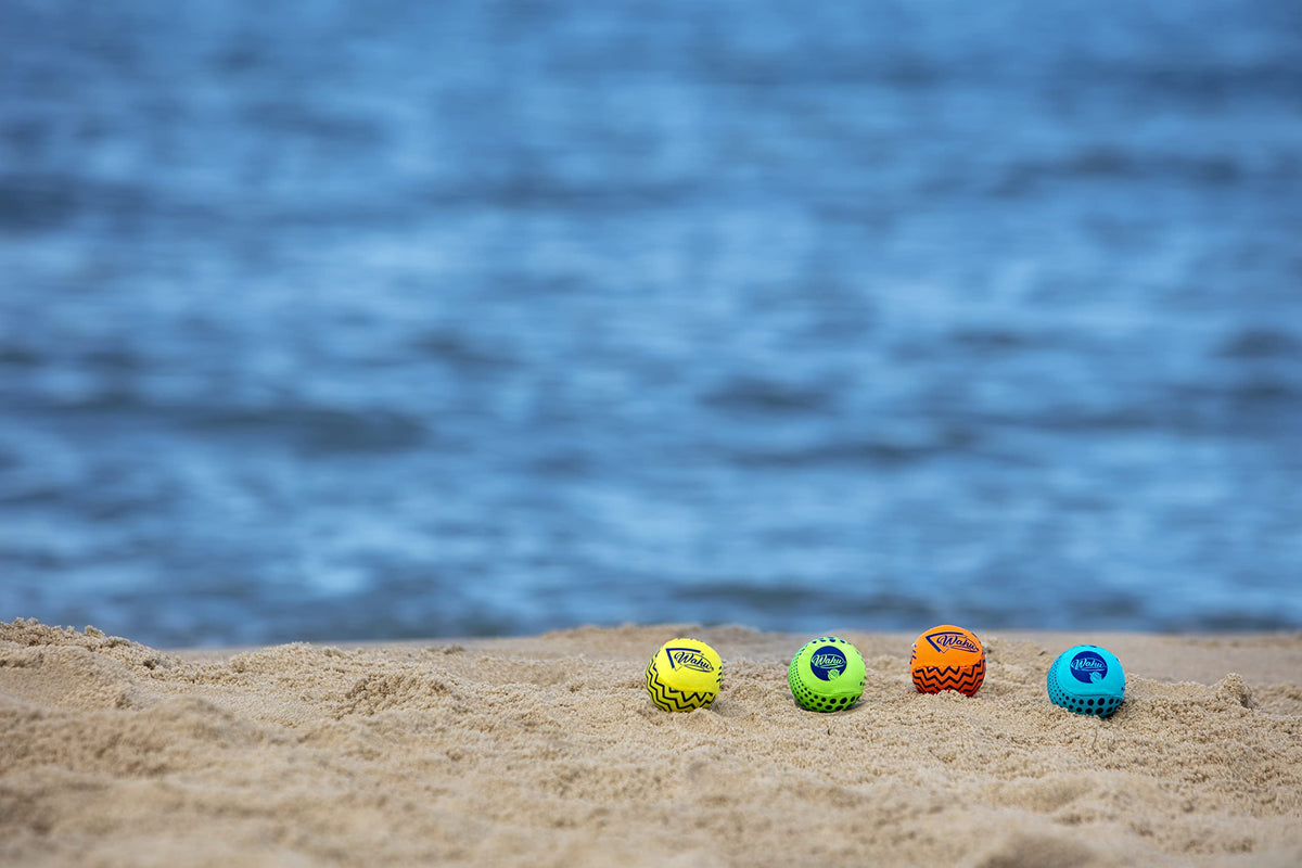 Orange Wahu pool toy skipping across the water surface demonstrating long distance capabilities