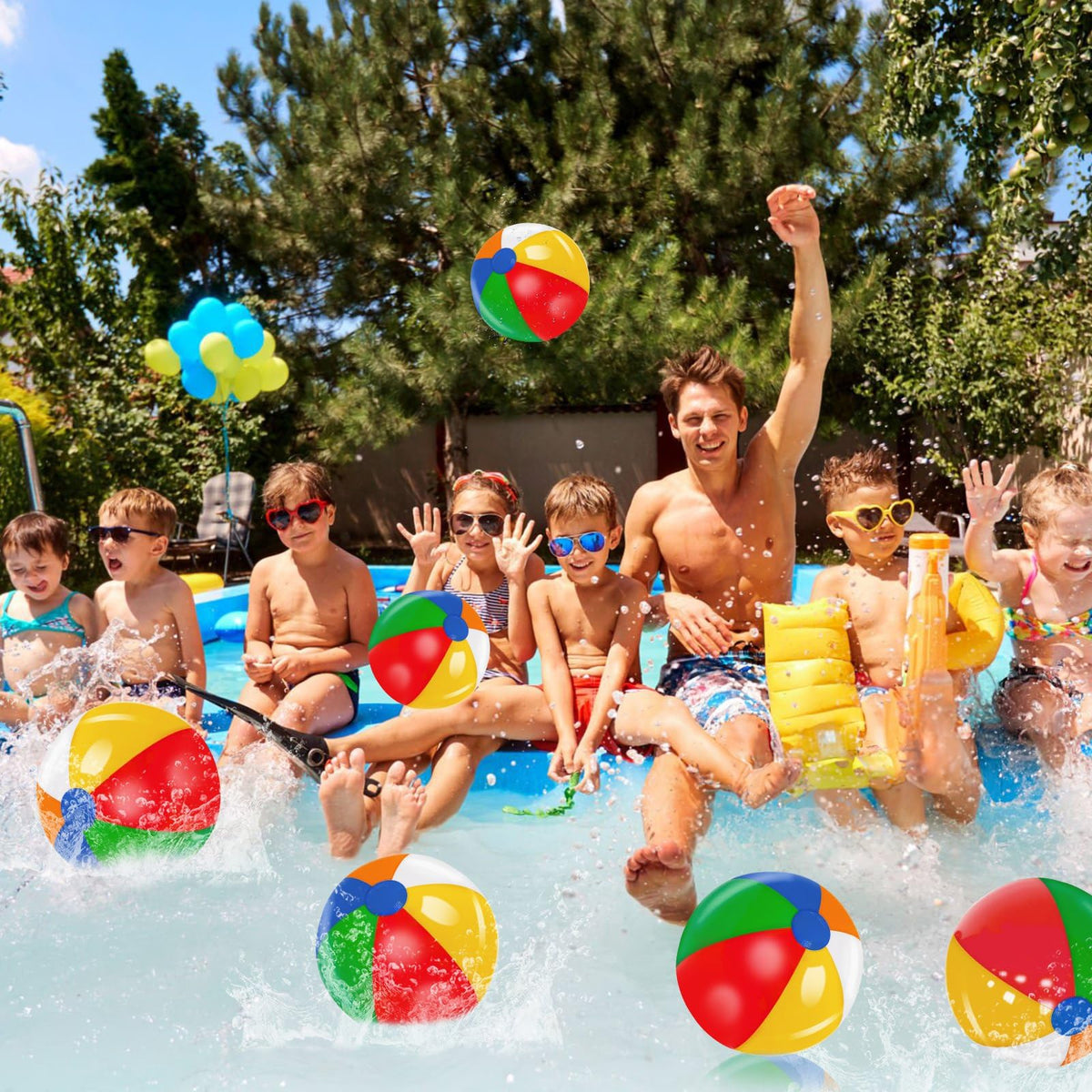 Group of children playing with multiple inflatable water toys during a Hawaiian tropical themed birthday party