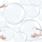 Sratte 16 inch clear classic water game ball floating inside an elegant outdoor swimming pool