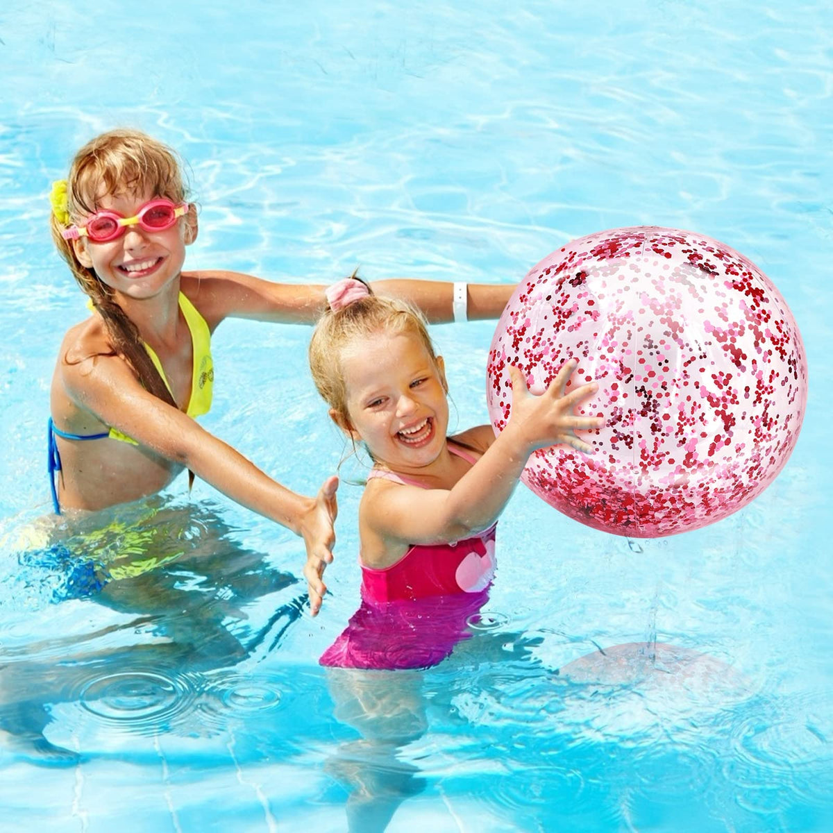 Deflated and neatly folded Turnmeon pink glitter beach balls showcasing easy storage potential.