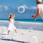 Yinder transparent six-inch mini beach balls floating in a swimming pool