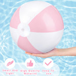 Four deflated pastel pink MiniInflat beach balls packed tightly for compact travel and easy storage.