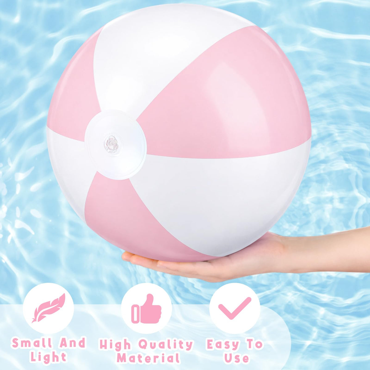Four deflated pastel pink MiniInflat beach balls packed tightly for compact travel and easy storage.