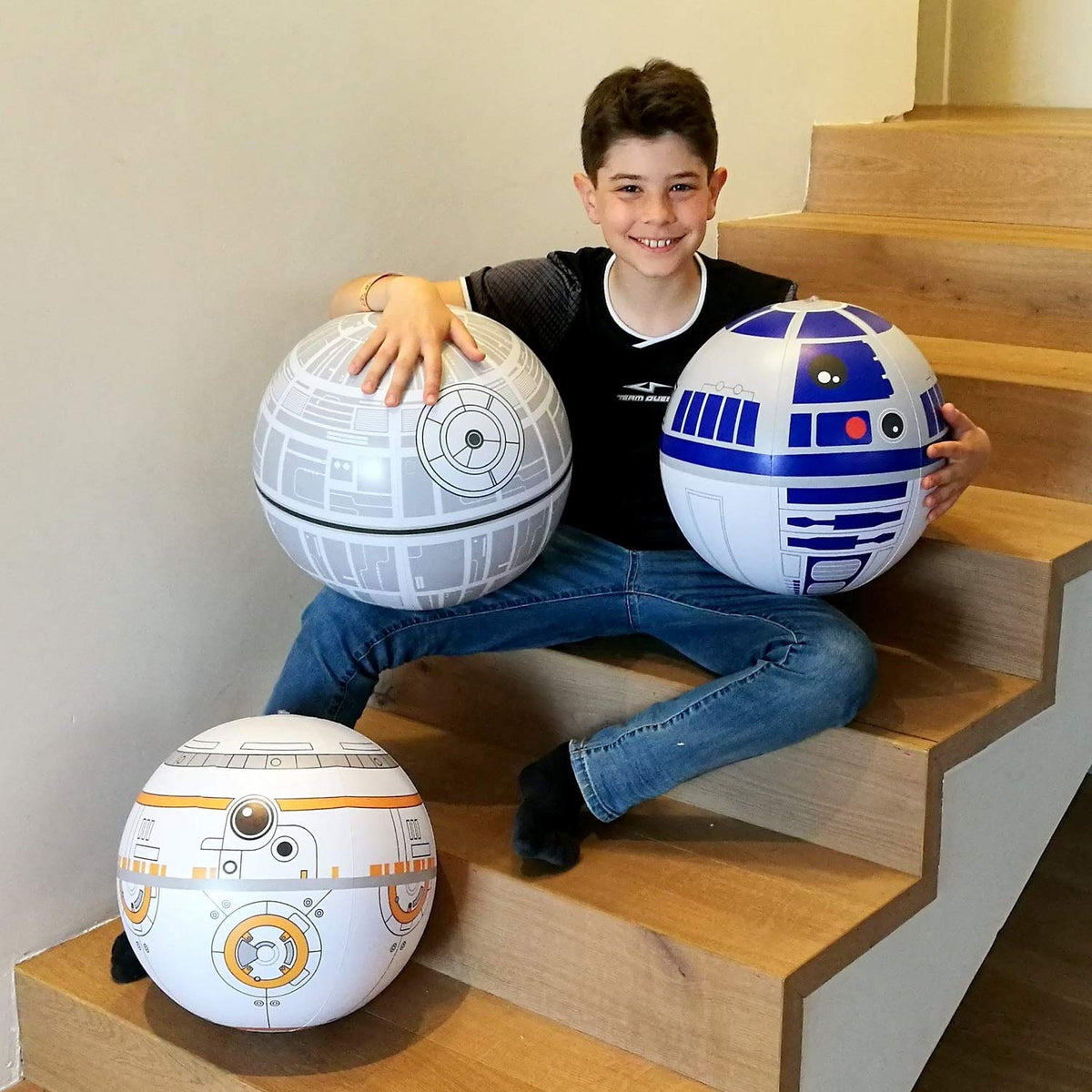 Ninostar Star Wars inspired inflatable party props being held by children during a game.