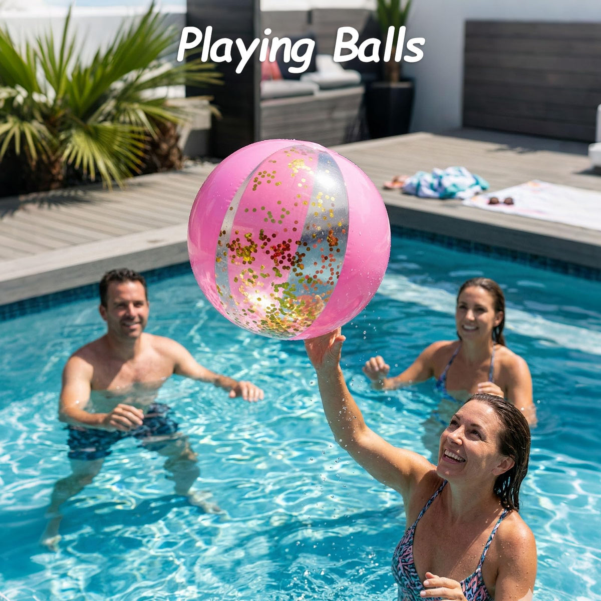 AMOR PRESENT glitter beach ball floating on water showing reflective gold confetti catching the summer sunlight.