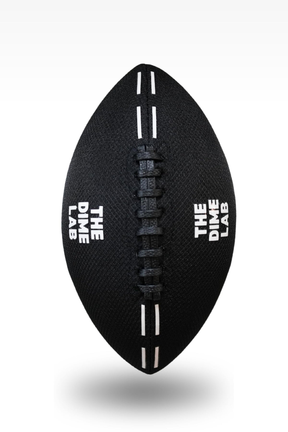 The Dime Lab Water Football side profile displaying the raised textured double laces and professional athletic build.
