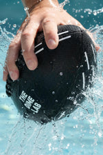 Close up view of the patent pending silicone grip lines on the finger pads of the premium aquatic sports ball.