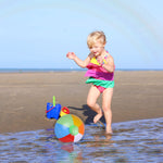 Kids playing with colorful twelve inch blow up water toys at an outdoor birthday celebration.