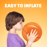 Bedwina sixteen inch inflatable basketballs arranged as decorations for a sports themed birthday party table.