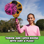 Family playing catch with Koosh Flix Stix outdoors