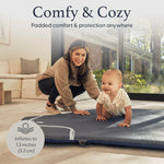 Parent using pop up baby mat outdoors at the park