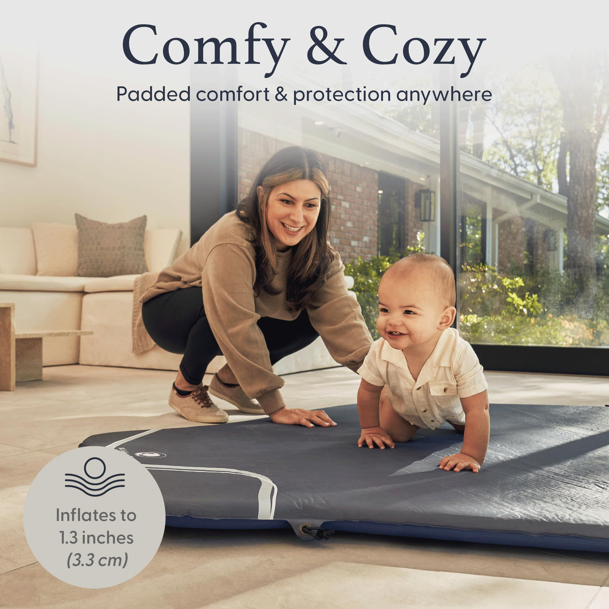 Parent using pop up baby mat outdoors at the park