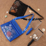 Child using Muyizi beach shovel on the shoreline