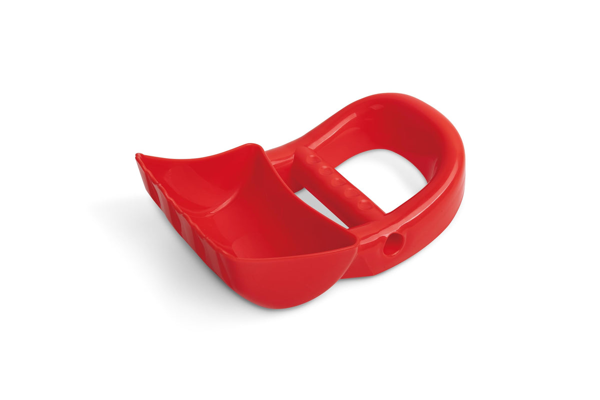 Toddler using Hape Hand Digger in sand
