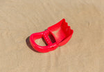 Non-toxic red sand shovel for sandbox activities