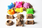Child playing with Mukool kinetic sand molding tools