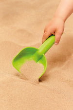 Hape beach set components arranged on sand