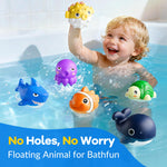 Toddler demonstrating how to press the button to release the floating ocean animals.