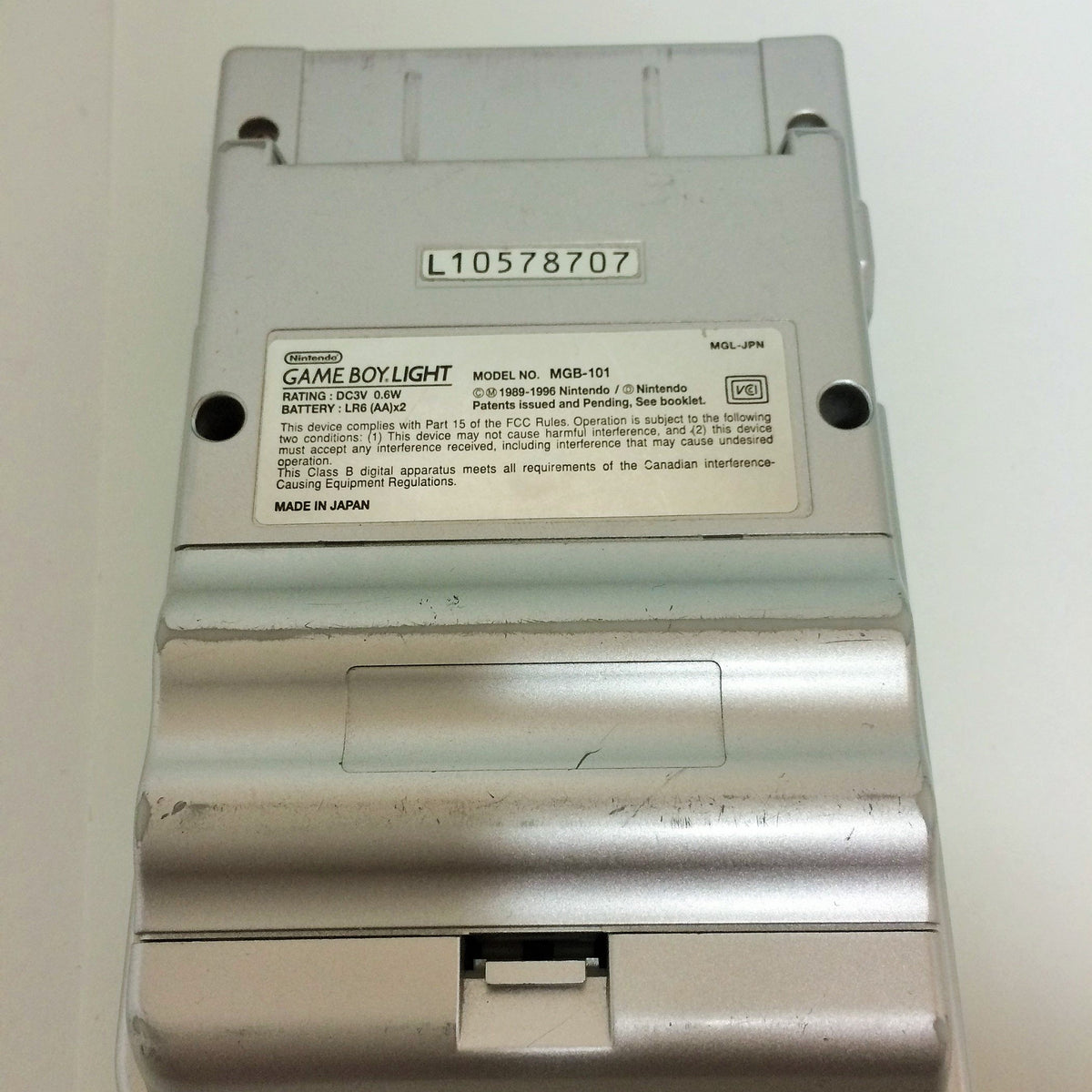 Nintendo Game Boy Light Silver battery compartment and rear