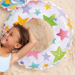 Intex inflatable toddler swimming pool set with tropical fruit print graphics on a backyard lawn