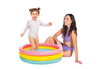 Intex colorful round swimming pool for children set up on backyard grass.