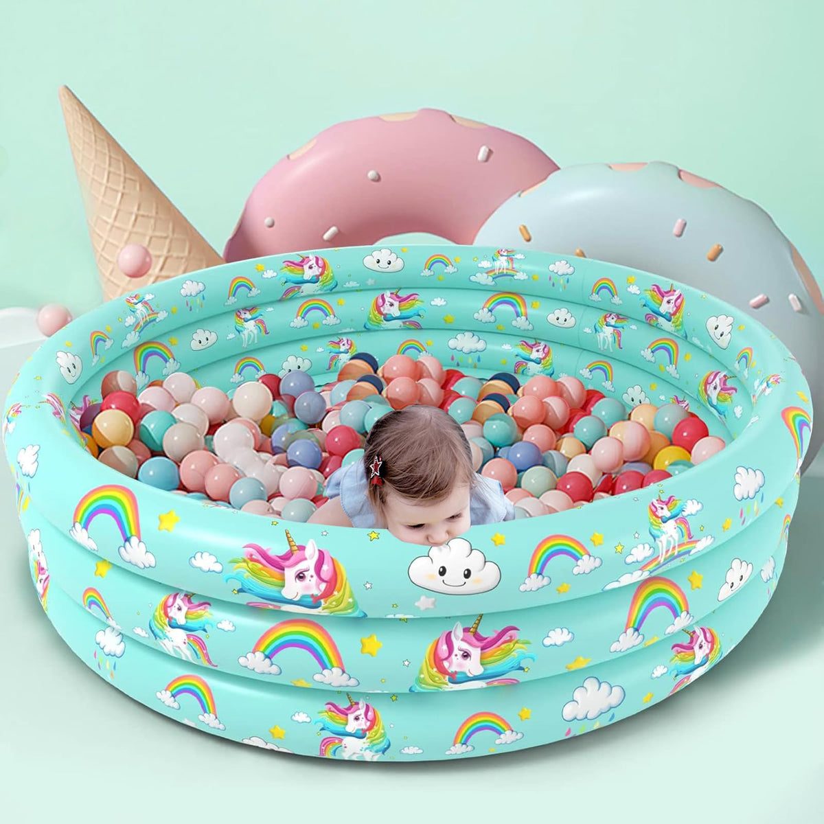 Bottom angle showing the integrated plastic water drain valve of the unicorn kiddy pool for easy drainage.