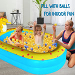 Three children playing comfortably inside the spacious sixty seven inch UMEELR inflatable wading pool on a backyard lawn