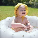 AirSwim baby splash station inflated indoors and filled with colorful plastic balls